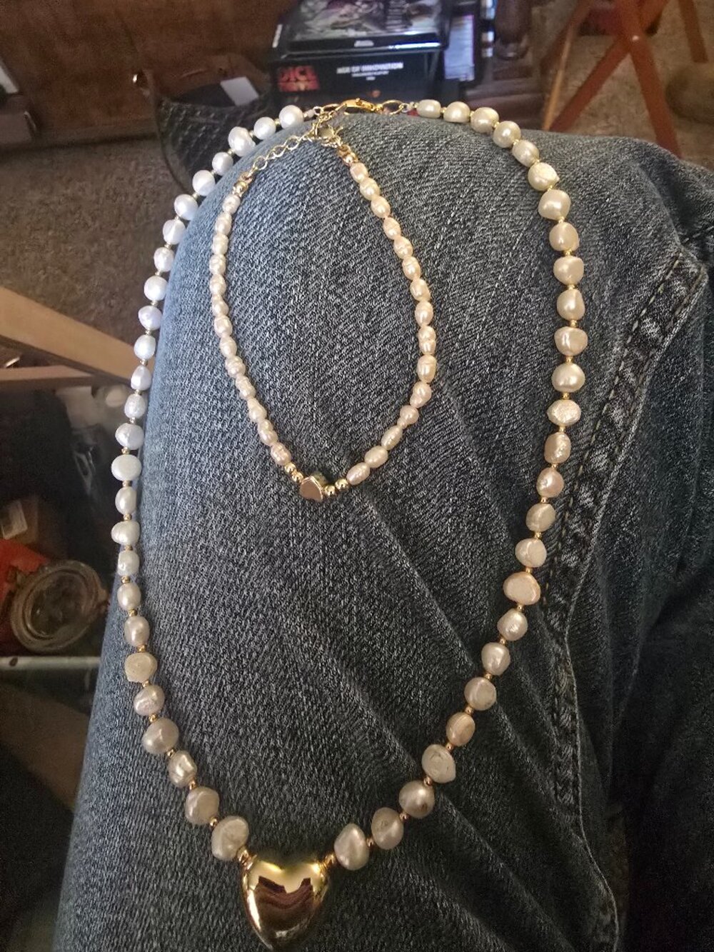Freshwater pearls puffy gold tone accents with hearts.